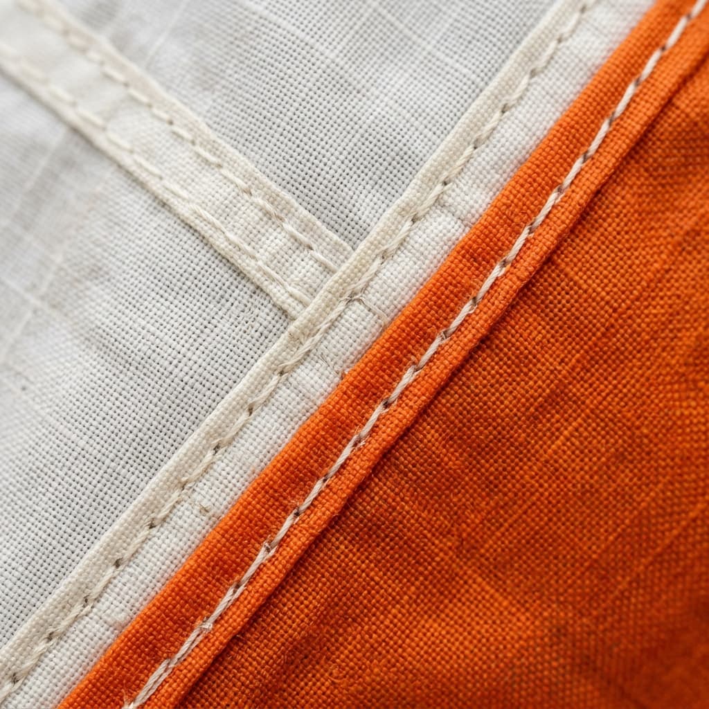 Macro lens view of the deeply complex woven ripstop structure on a high performance parachute canopy